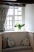 Traditional window niche with integrated window seat and cushions