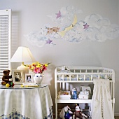 Nursery with hand-painted wall
