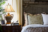 Elegant bed and nightstand in front of window