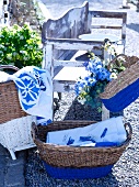 Wicker basket and hand bag, the bottom halves painted blue, for storage