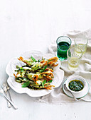 Deep-fried courgette flowers with ricotta, parmesan, and mint and anchovy sauce