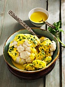 Cauliflower with a saffron and cheese sauce and boiled potatoes