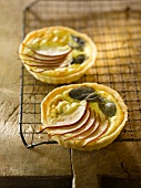 Two Mini Stilton Cheese and Pear Tarts; On a Cooling Rack