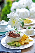 Chilli con carne with avocado and tortilla chips