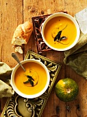 Pumpkin soup with bread (seen from above)