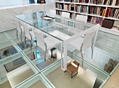 Glass conference table in room with glass floor