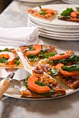 Pizza topped with pancetta, brie and papaya