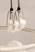 Whipped egg whites on the blender whisk attachments