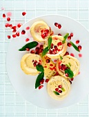 Artichoke hearts with hollandaise sauce, mint and pomegranate seeds