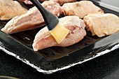 Brushing Chicken with Melted Butter; Chicken on a Broiling Pan