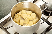 Peeled and Chopped Potatoes in a Pot of Water for Boiling