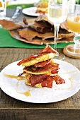 Corn fritters (deep-fried corncakes) with bacon and syrup