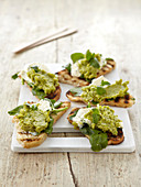 Bruschetta topped with bean purée and goat's cheese