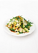 A salad of lettuce, avocado, rocket and Parmesan