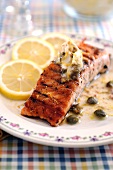 Fried salmon fillet with anchovies and caper butter