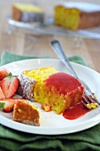A slice of rice cake with strawberries and strawberry sauce