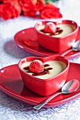 Vanilla panna cotta with strawberries in heart-shaped dishes