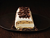 Tiramisu cake on wooden plate