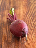 A beetroot on a wooden surface