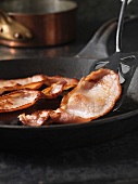 English bacon in frying pan