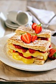Puff pastry slices with cream and strawberries