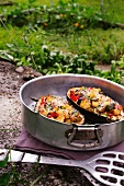 Aubergines filled with peppers, courgettes and croutons