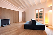 Minimalistic living room with hardwood floors