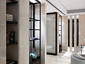 Cool interior ambiance created by pale, reflective marble surfaces and black wood fittings