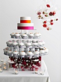 Display with frosted cupcakes and cake