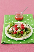 Spinach salad with raspberries and gorgonzola cheese