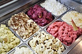 Various type of ice creams in a freezer in an ice cream parlour