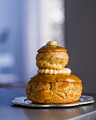 A tower of profiteroles filled with cream