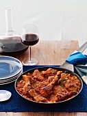 Tomato Based Chicken Stew Cooked in a Skillet; With Red Wine