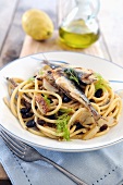 Bucatini pasta with pan fried sardines, fennel and raisins