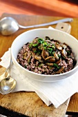 Red wine risotto with garlic and parsley button mushrooms
