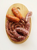 Two Types of Sausage on a Cutting Board; From Above