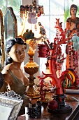Collection of souvenirs on sideboard - jewellery tree, bust, bedside lamp