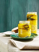 Jars filled with lemons and oil