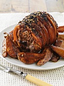 Glazed roast pork with roasted pears