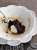 Remains of chocolate and date pudding in a bowl