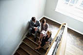 Business people talking on steps