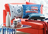 Red chaise armchair with maritime scatter cushions