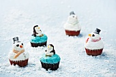Penguin and snowman cupcakes