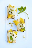 Shortbread topped with mango and a dollop of pistachio cream