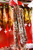 Spanish Dry Aged Sausages Hanging on Display at the La Boqueria Market in Barcelona, Spain