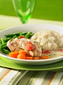 Braised chicken with vegetables, a light sauce and mashed potatoes