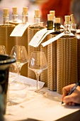 Degustation forms being filled out at a wine tasting session