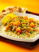 North African chicken ragout with chickpeas and sweet potatoes on a bed of couscous
