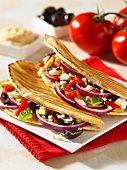 Grilled unleavened bread with vegetables and feta cheese