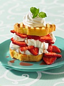 A shortcake sandwich with cream and strawberries